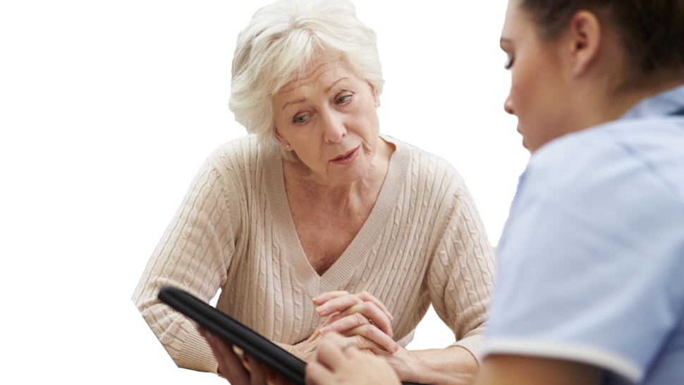 Doctor on iPad with female patient