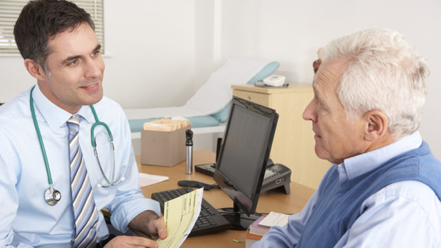 GP talking to male patient